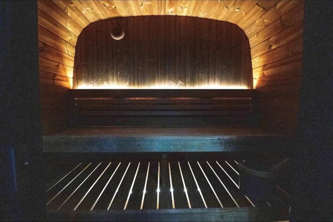 The sauna at PRS, lit in warm wood